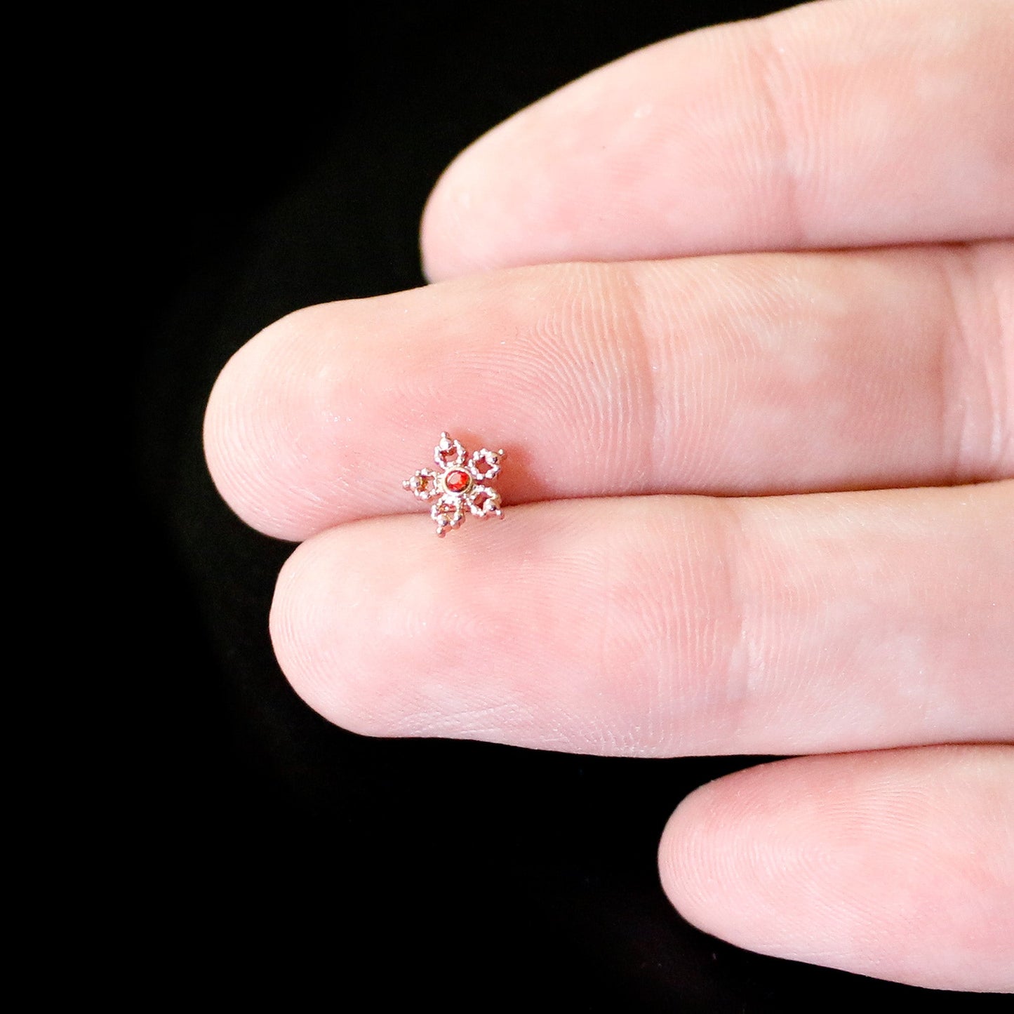 20G 1/4 Red Gem Rose Gold Tone Textured Snowflake Nose Bone