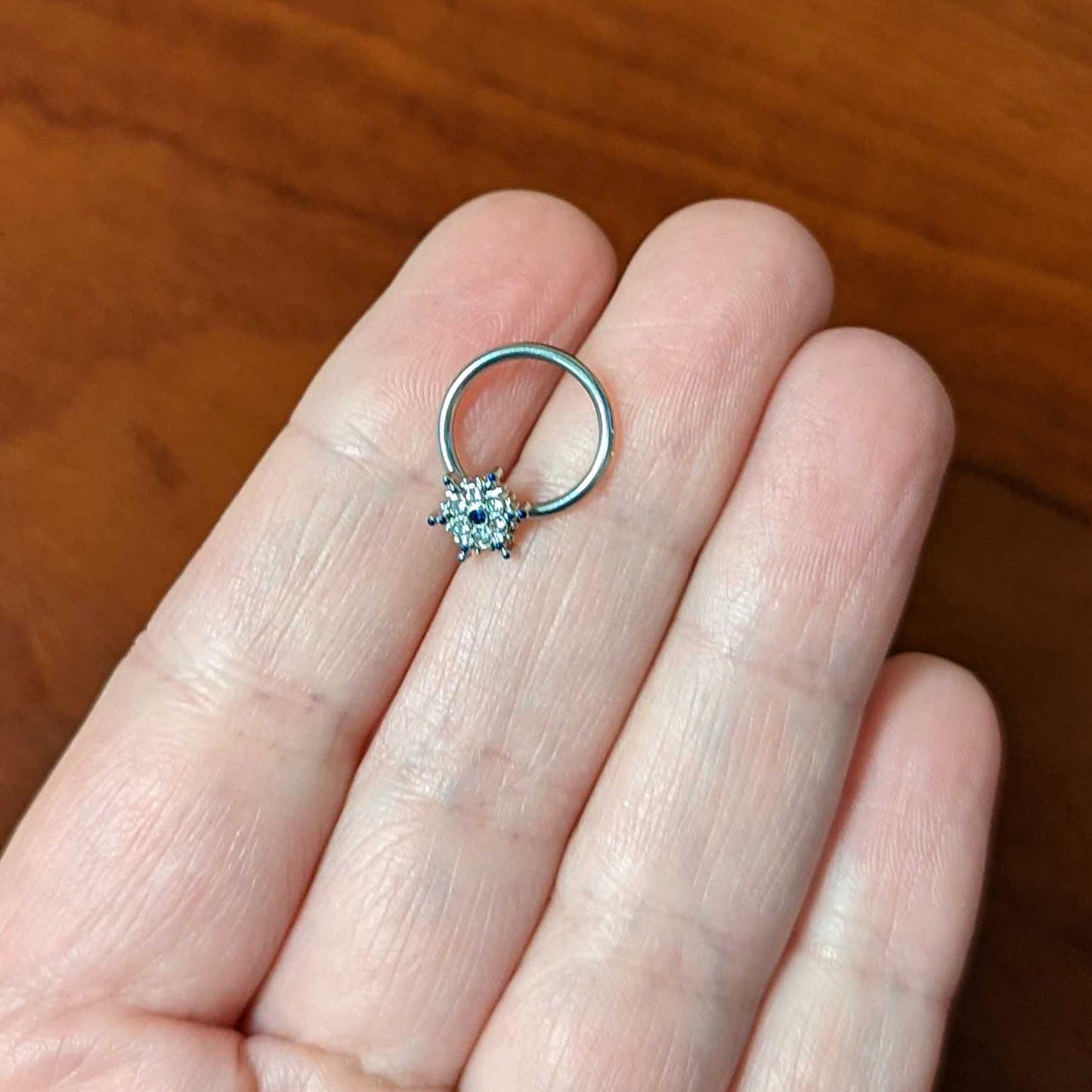 16G 3/8 Clear Blue Gem Festive Snowflake BCR Captive Ring