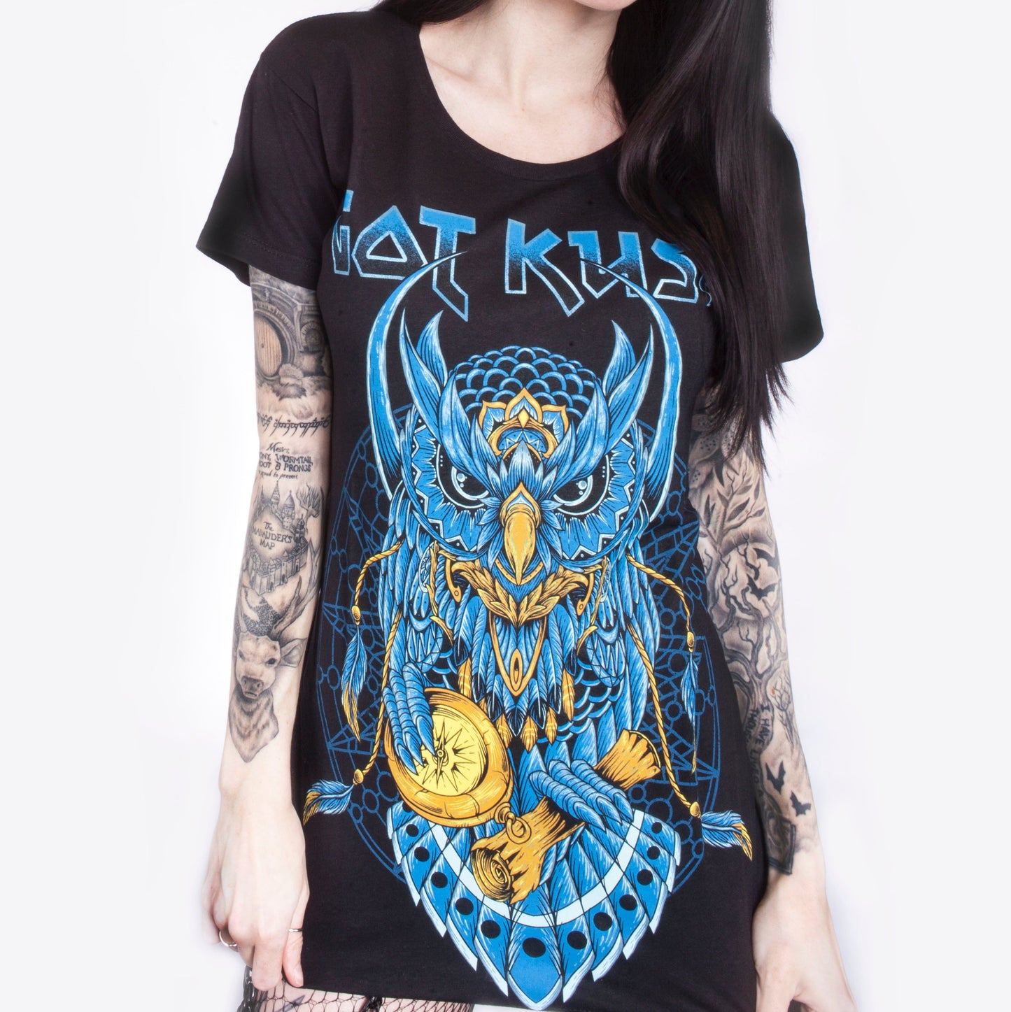 Person wearing a black t-shirt with a blue and gold owl design and 'Hot Kiss' text.