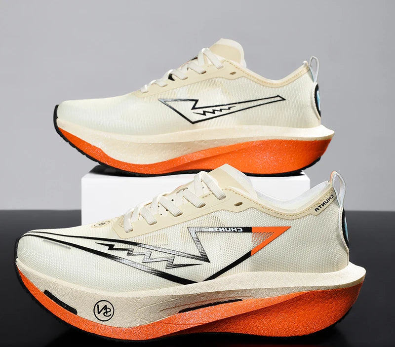 White and orange running shoes with a brand logo on a reflective surface.