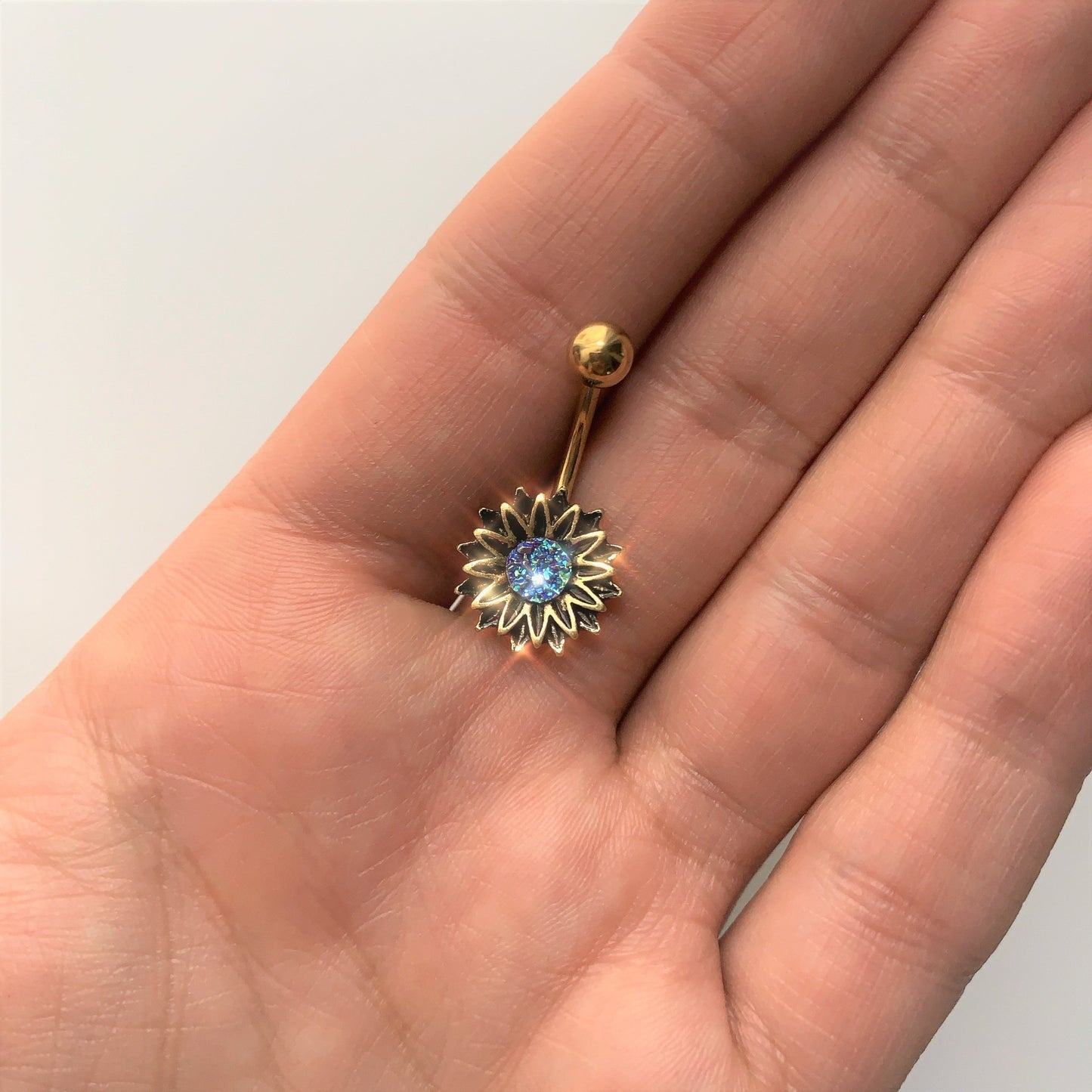Gold Tone Aqua Center Sunburst Flower Belly Ring