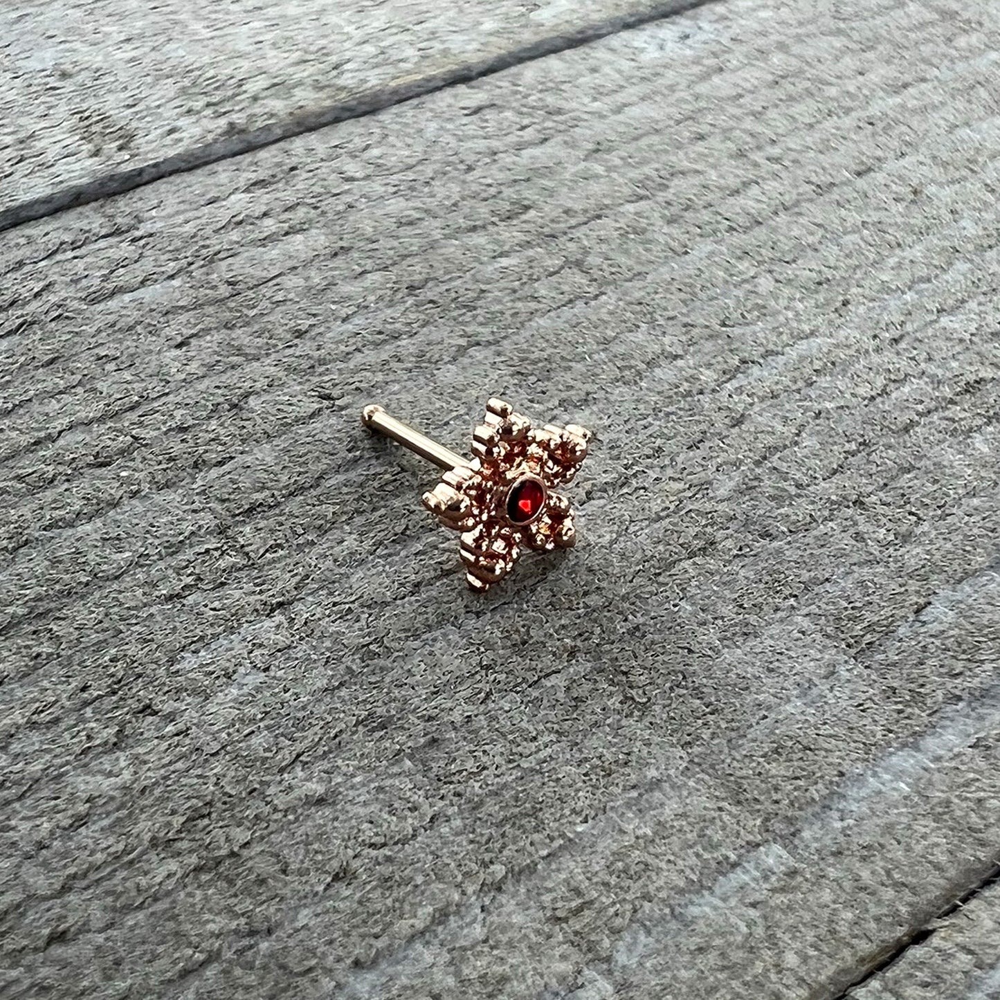 20G 1/4 Red Gem Rose Gold Tone Textured Snowflake Nose Bone