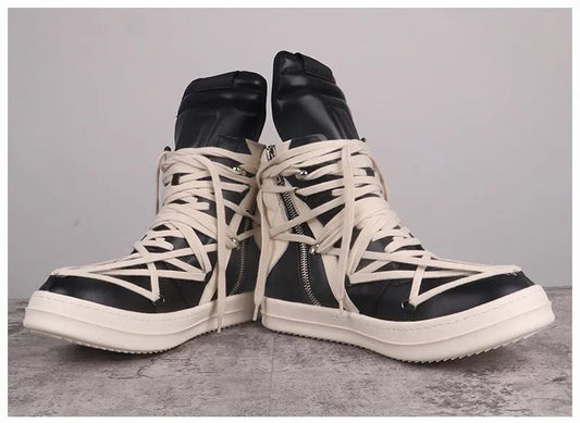 Black and white high-top sneakers with unique design on a gray background