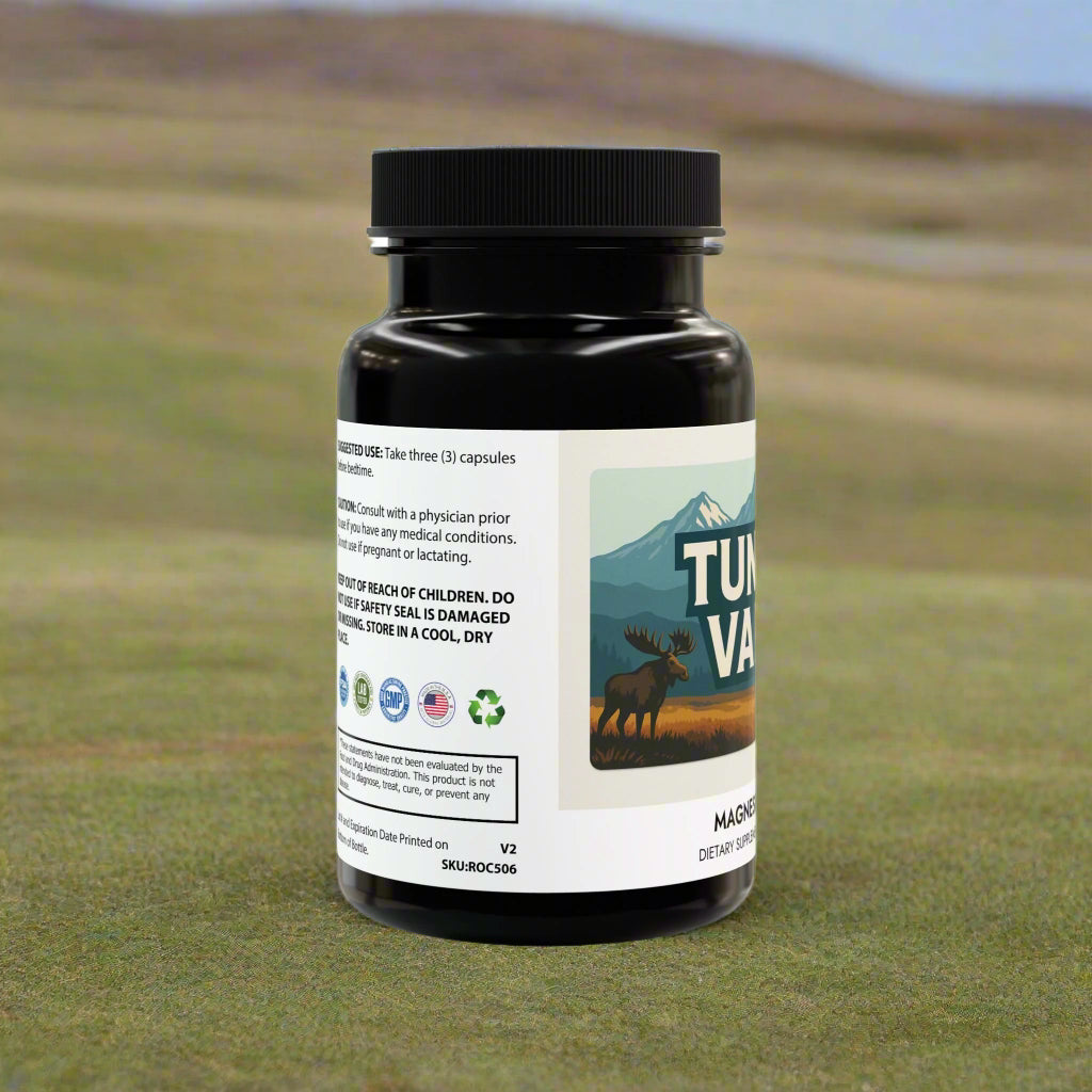 Black supplement bottle with a label featuring a moose and mountain design on a white background