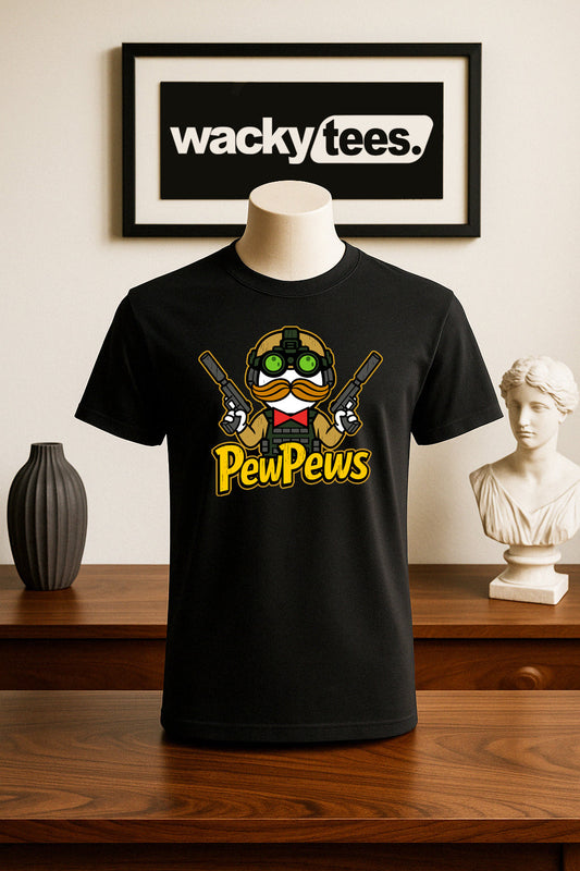 Black t-shirt with 'PewPews' design on a mannequin, framed 'wackytees' sign in the background.