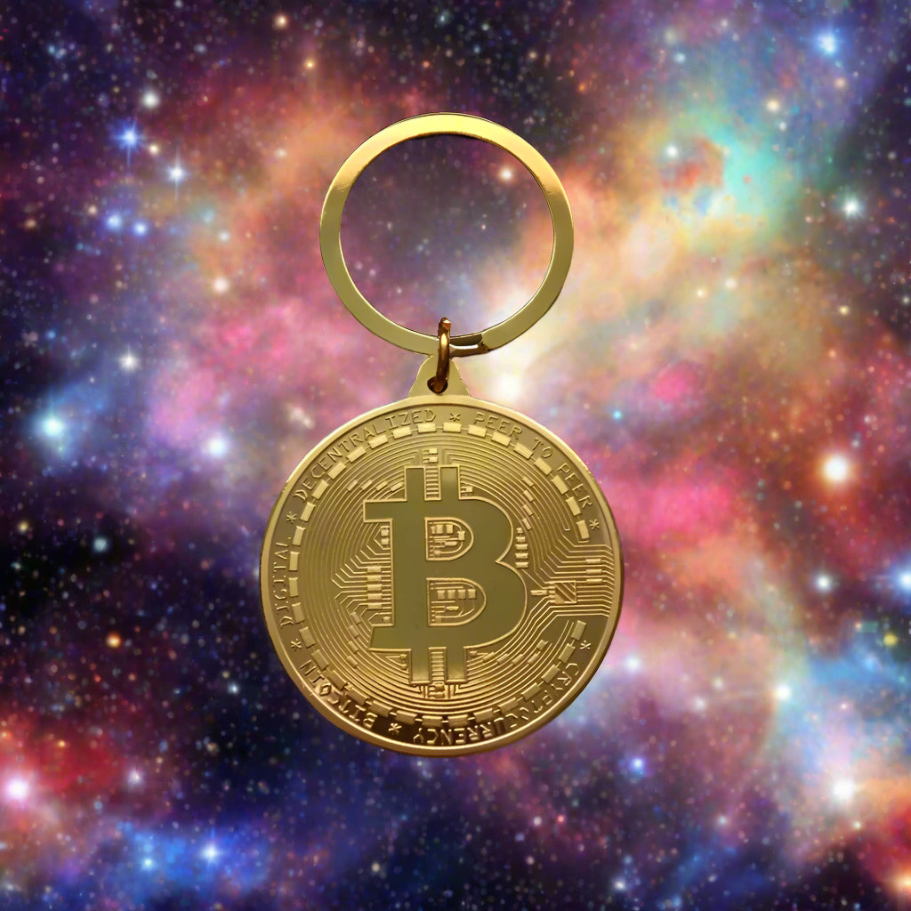 Gold Bitcoin keychain on a black background