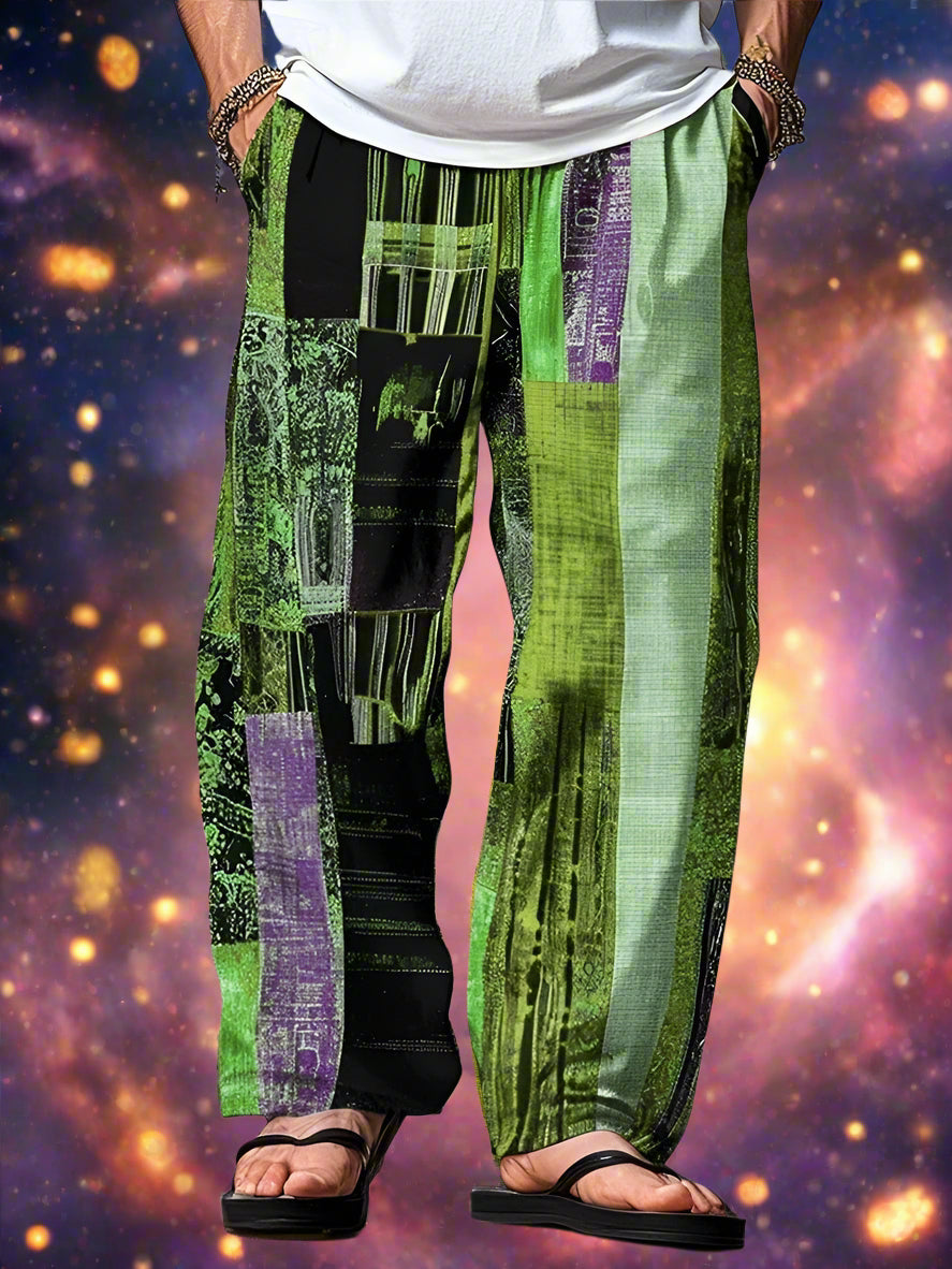 Green and black patterned pants worn by a person on a light gray background

