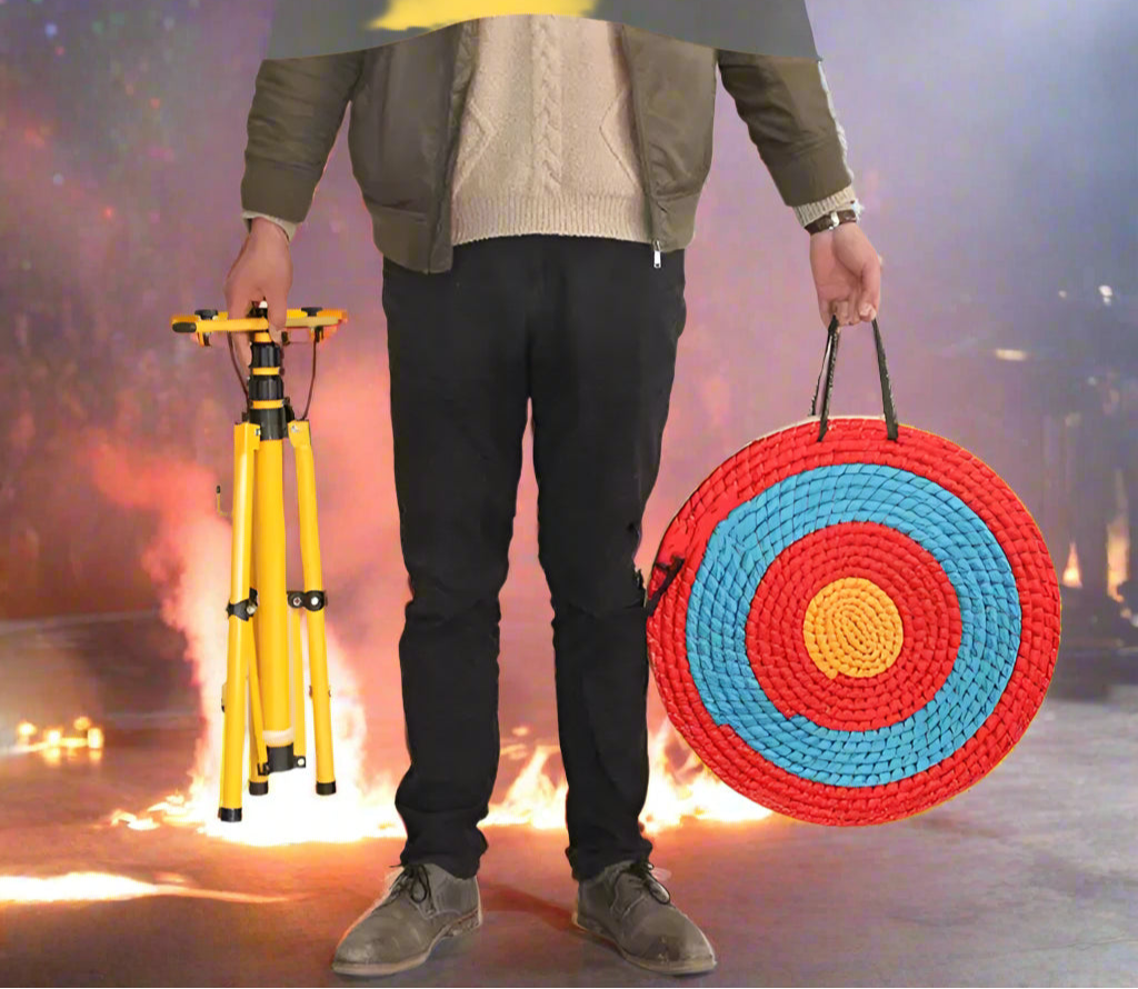 Person holding a yellow tripod and a red, blue, and yellow target-like object.