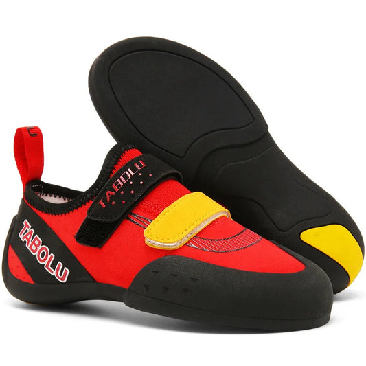 Red and black climbing shoes with yellow accents on a white background