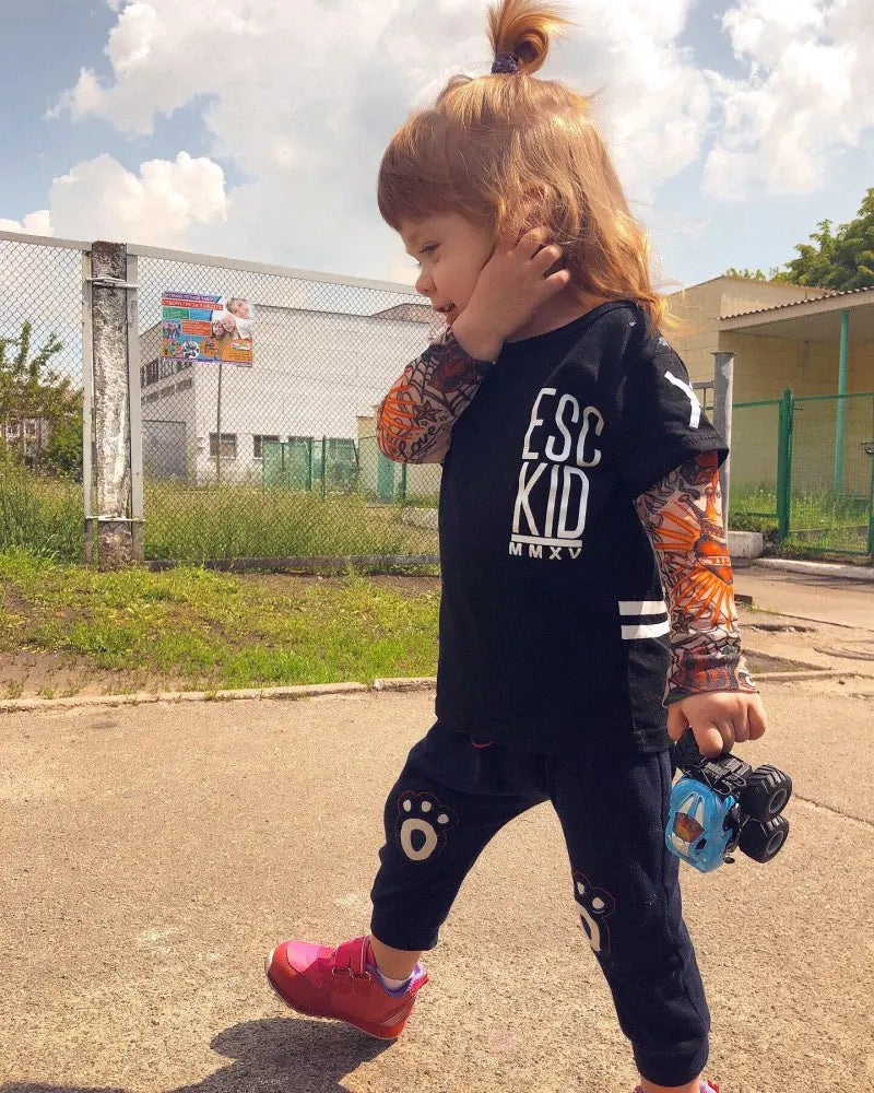 Little Rebel Inked Long Sleeve Tee – punk rock tattoo-print cotton top for future stage legends