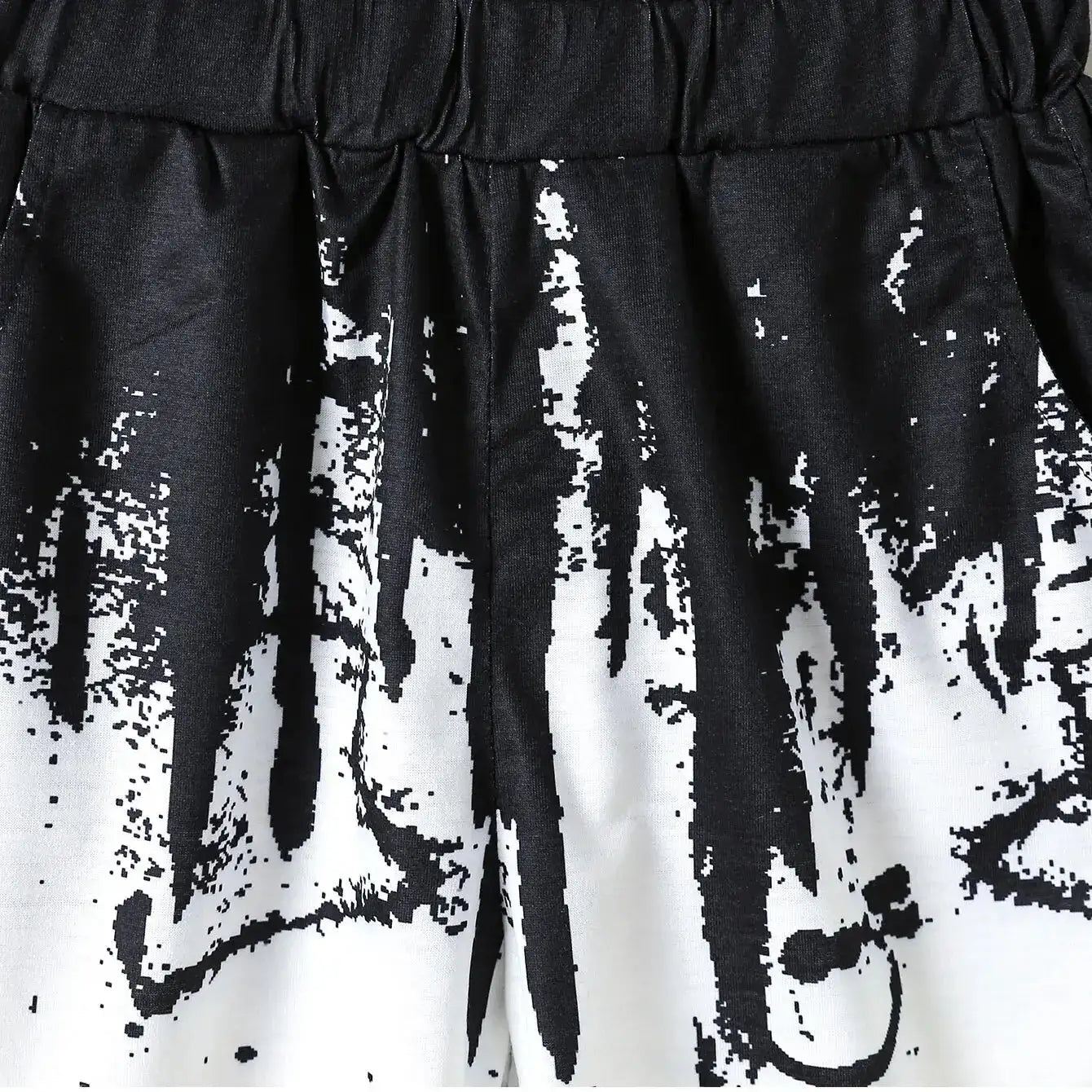 Boys' Summer Set: Cool Black & White Round-neck T-shirt with Slanted Pocket, Paired with Matching Shorts for Casual Play.