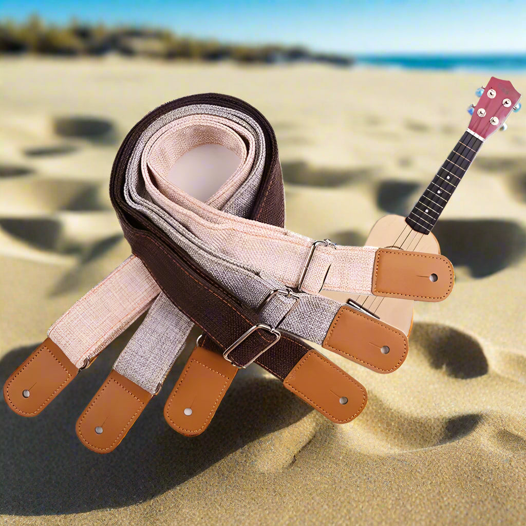 Set of ukulele straps in different colors on a white background