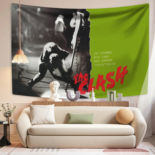Tapestry with 'The Clash' design hanging on a wall above a sofa in a living room.