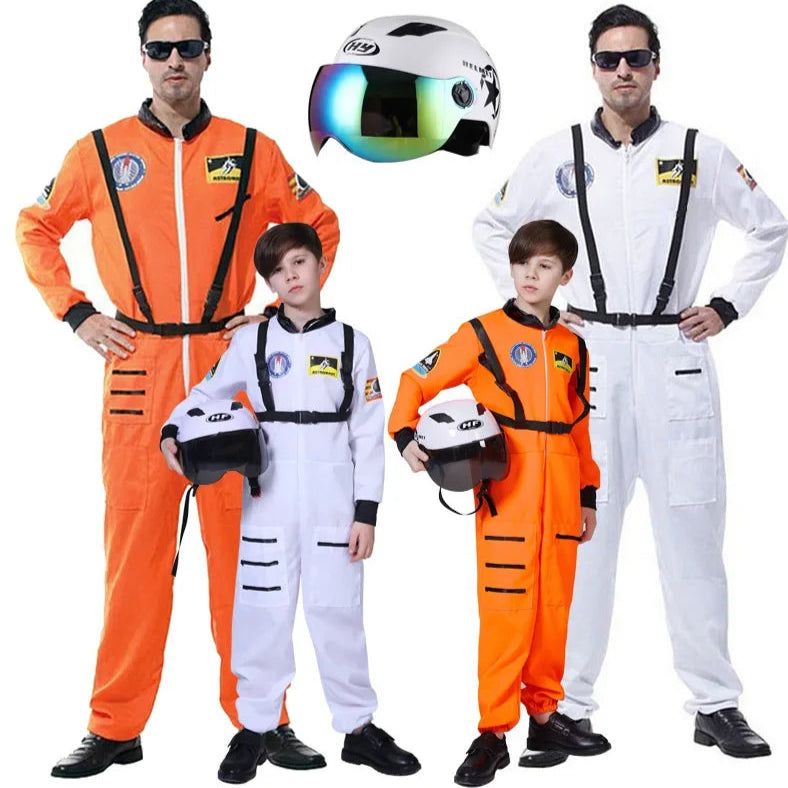 Two adults and two children wearing orange and white astronaut costumes with helmets on a white background.