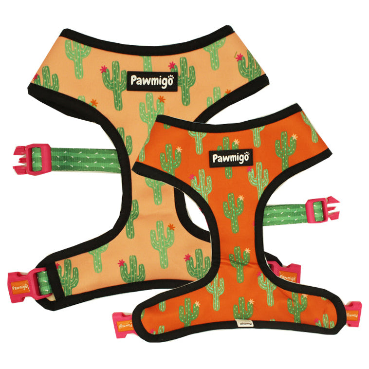 Two dog harnesses with cactus pattern and Pawmigo branding on a white background
