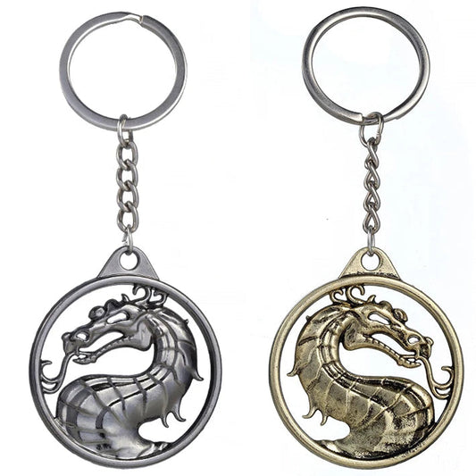 Two dragon-shaped keychains, one silver and one bronze, on a white background.