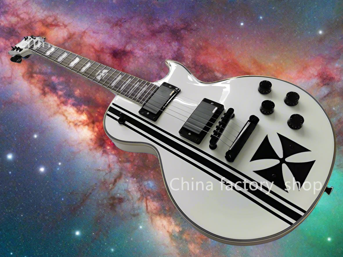 White electric guitar with black designs on a gray background