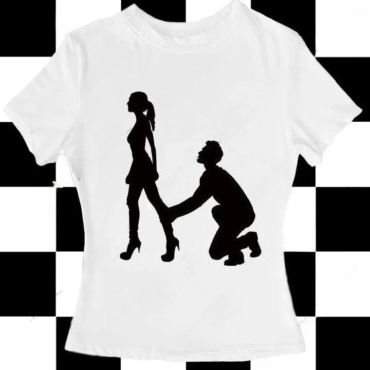 White t-shirt with black silhouette design of a man proposing to a woman on a checkered background