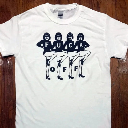 White t-shirt with graphic design of women and text on a wooden surface