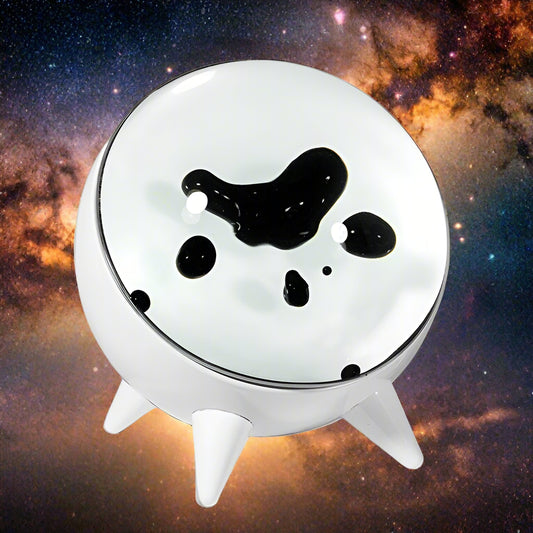 White pet feeder with black spots on a white background