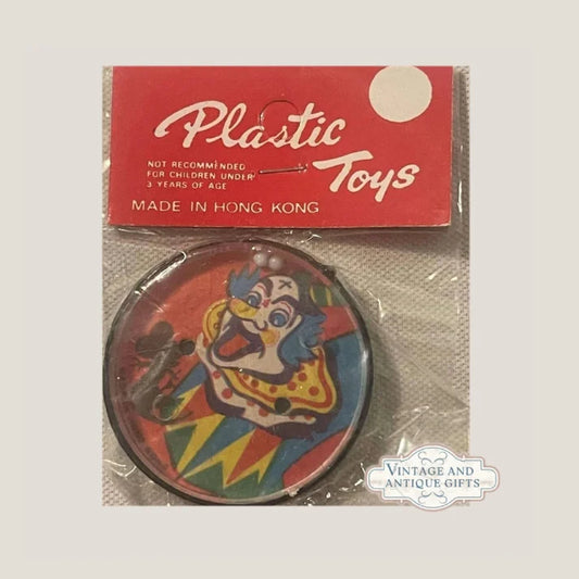 Discover the Enchanting 1950s Clown and Mouse Toy Puzzle Game