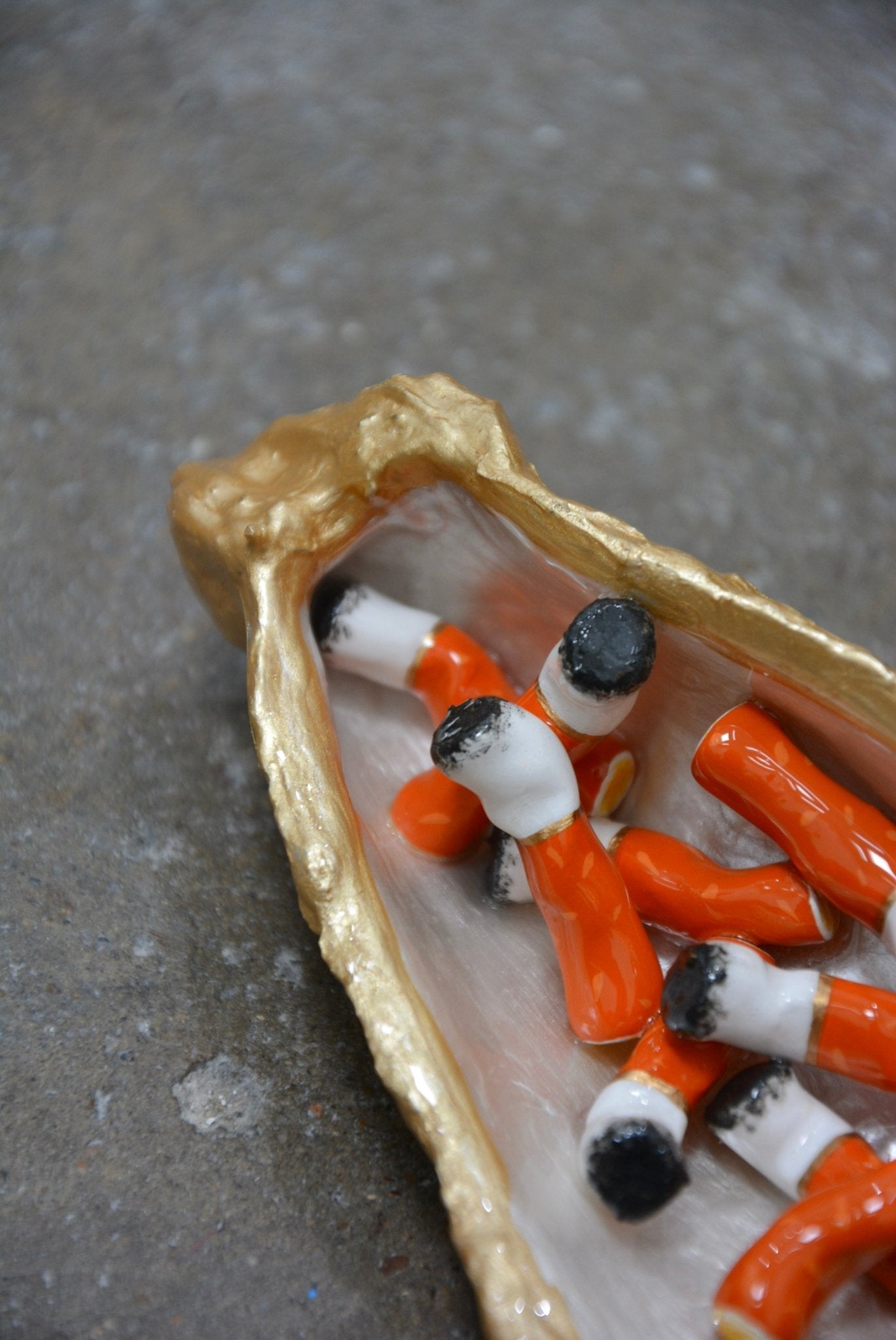 OYSTER SHELL CIGARETTE SCULPTURE