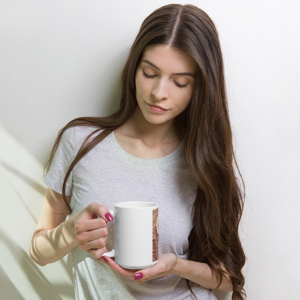 a woman holding a cup of coffee 